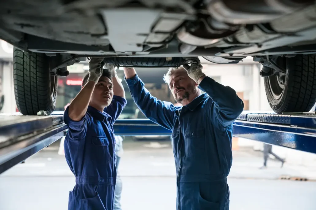 auto techs working together in the shop