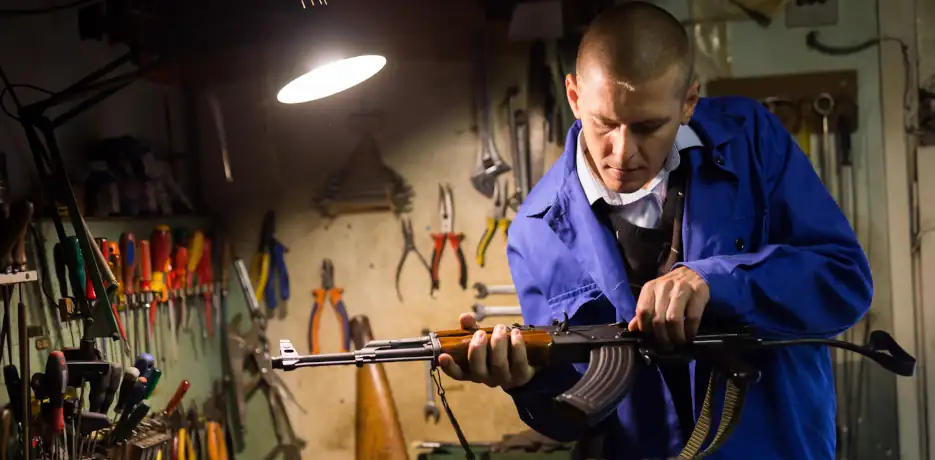 gunsmith working in his shop