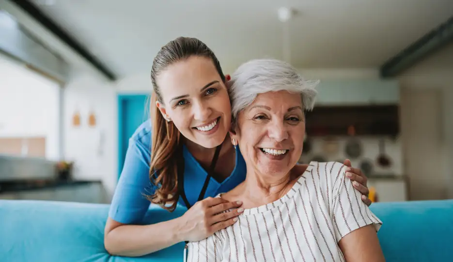 home health aide with elderly woman in her house