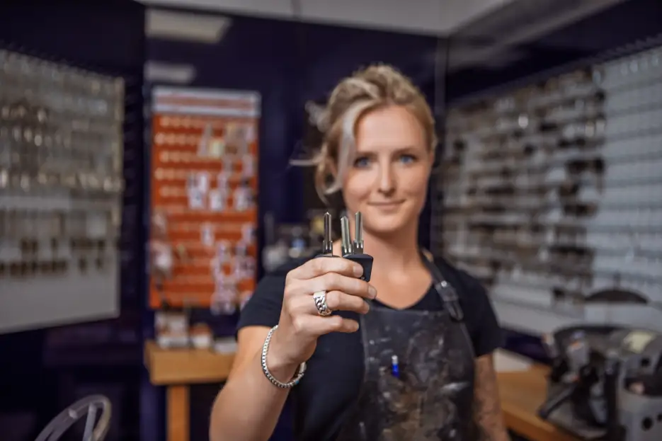 female locksmith in her shop