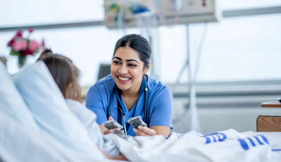 medical assistant helping patient